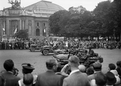 (FILES) In this file photo taken on August 26, 1944 US soldiers of Allied troops parade on the Champs Elysées Avenue in Paris, to celebrate the Liberation of Paris during the Second World War. / AFP / -
