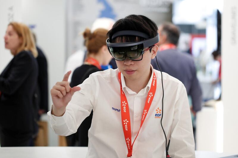 An attendee uses a Virtual Reality (VR) headset at the World Nuclear Exhibition (WNE), the trade fair event for the global nuclear community in Villepinte near Paris, France, June 27, 2018. REUTERS/Benoit Tessier