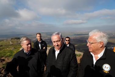 Israeli Prime Minister Benjamin Netanyahu, Republican US Senator Lindsey Graham and US ambassador to Israel David Friedman visit the border line between Israel and Syria at the Israeli-occupied Golan Heights. EPA