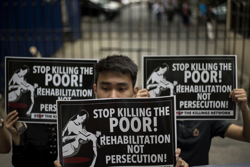 Activists protest in front of the Department of Justice building in Manila. Noel Celis / AFP Photo