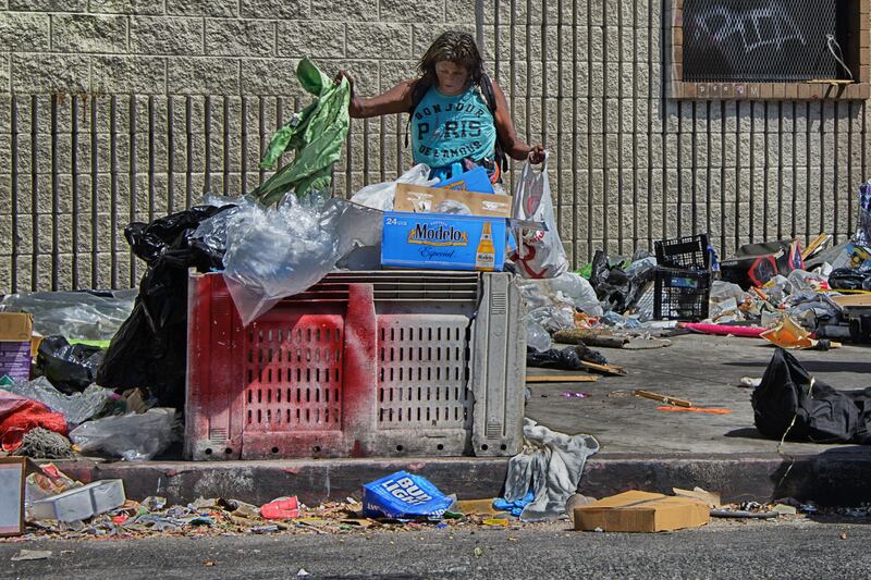 A homeless woman salvages in Skid Row in downtown Los Angeles. Photo: Russ Allison Loar