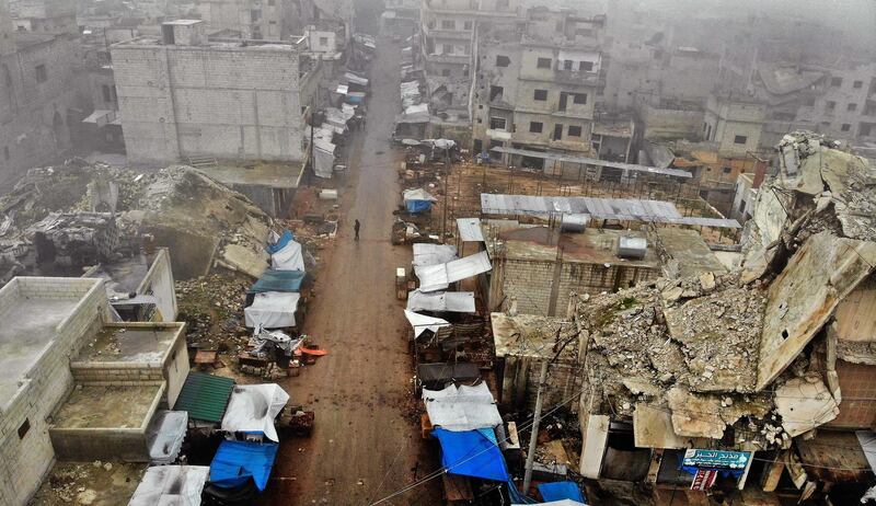 An aerial view shows the aftermath of an air strike by pro-regime forces on the rebel-held town of Ariha in the northern countryside of Syria's Idlib province.  AFP