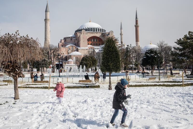 Children play in the snow in front of the Hagia Sophia Grand Mosque on February 17, 2021 in Istanbul, Turkey. Getty Images