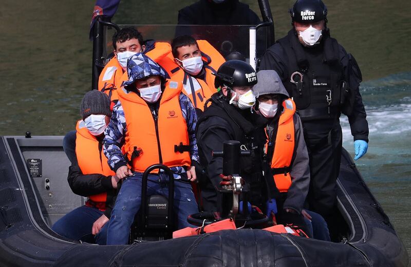 A group of people thought to be migrants are brought in to Dover, Kent, by Border Force officers following a small boat incident in the Channel earlier this morning. Picture date: Tuesday April 20, 2021. (Photo by Gareth Fuller/PA Images via Getty Images)