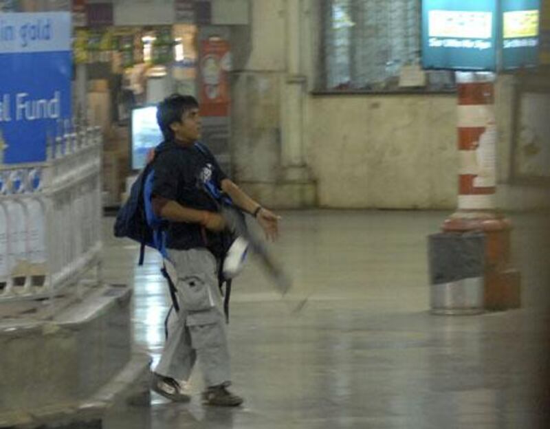 Mohammed Ajmal Kasab, the accused gunman walks through the Chatrapathi Sivaji Terminal railway station in Mumbai, India on November 26, 2008.