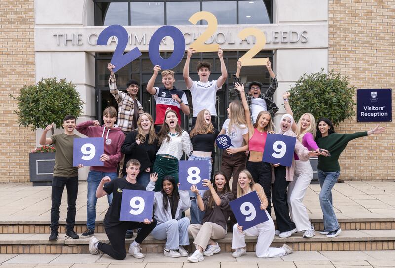 Students celebrate after receiving their GCSE results at The Grammar School in Leeds, Yorkshire. Picture date: Thursday August 25, 2022.