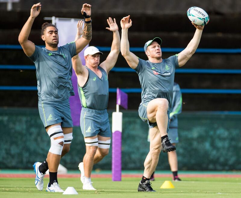 Australia's Lukhan Salakaia-Loto , Michael Hooper and David Pocock take part in a training session. AFP