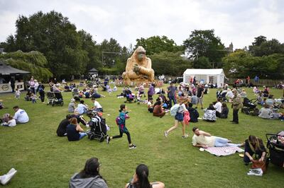 Visitors on closing day relax around the centrepiece of the final summer programme called ‘Wilder’, a specially commissioned interactive gorilla sculpture, which is taller than the largest giraffe ever recorded, and as wide as three king-size beds. PA