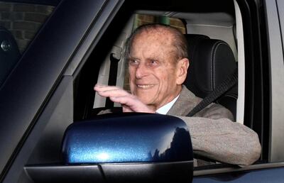 FILE PHOTO: Britain's Prince Philip is driven away from Papworth Hospital in southern England December 27, 2011.-   REUTERS/Neil Hall/File Photo