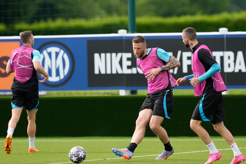 Inter Milan's Milan Skriniar, centre, trains with teammates. AP