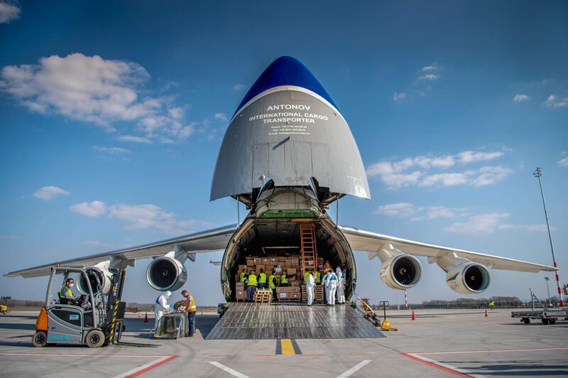 Workers unload boxes of protective medical equipment and material from an Ukrainian AN-124 cargo plane, arriving from China, at Liszt Ferenc Airport in Budapest, amid the spread of the novel coronavirus pandemic. AFP