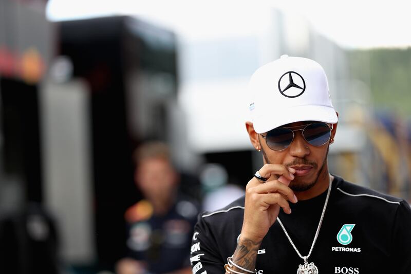 Lewis Hamilton says the collision with Sebastian Vettel is 'water under the bridge' but adds there are unanswered questions. Mark Thompson / Getty Images