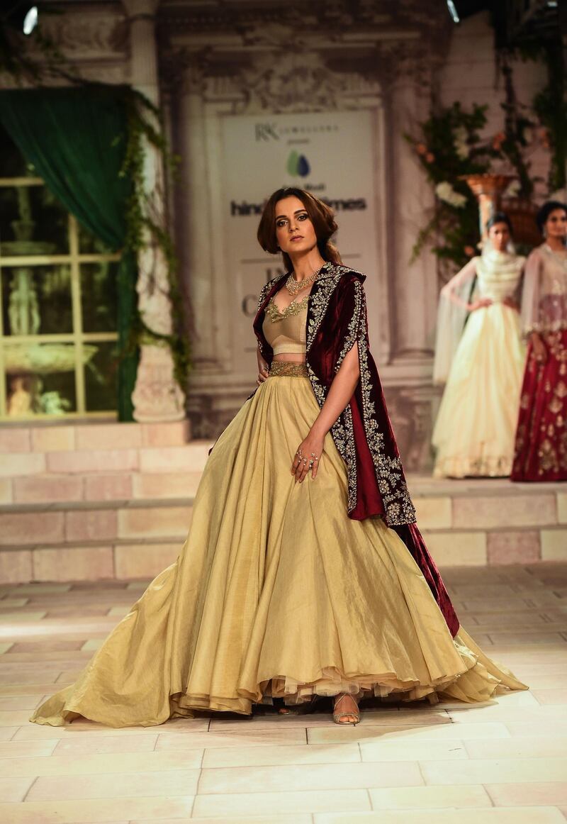 Showing her versatility, Anju Modi put Bollywood actress Kangna Ranaut in a cream lehenga with a Victorian-style velvet jacket. AFP