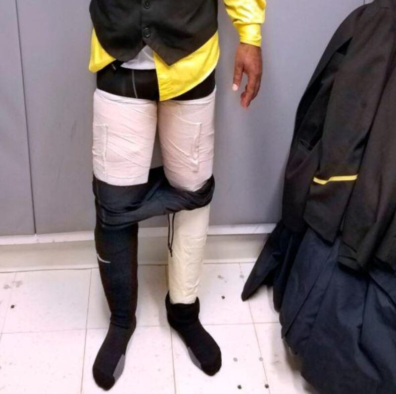 US Customs arrested this Fly Jamaica Airways cabin crew attendant, who was found to have 4kg of cocaine strapped to his legs and concealed under tights and trousers. The haul at New York's JFK Airport would have been worth about $160,000 on the street. Photo: US Customs and Border Protection