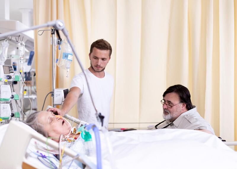 DUBAI, UNITED ARAB EMIRATES - JULY 8 2019.

Lucas places plays a recording of his sister reading Peter Pan to her mom. Their mother, Jody Anne fell in a coma a few days ago.

His stepfather, Jonathan Ali Khan,  right, is struggling with a hospital bill worth over Dh100,000 after Jody Anne, slipped into a deep coma less than ten days ago. The family are making a plea for help.

Photo by Reem Mohammed/The National)

Reporter:
Section: 