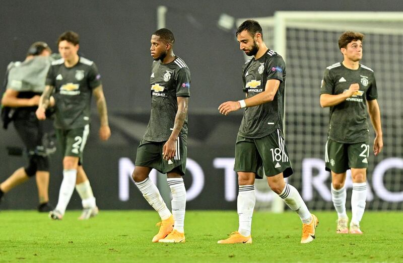 Manchester United's Bruno Fernandes and Fred look dejected after the match. Reuters