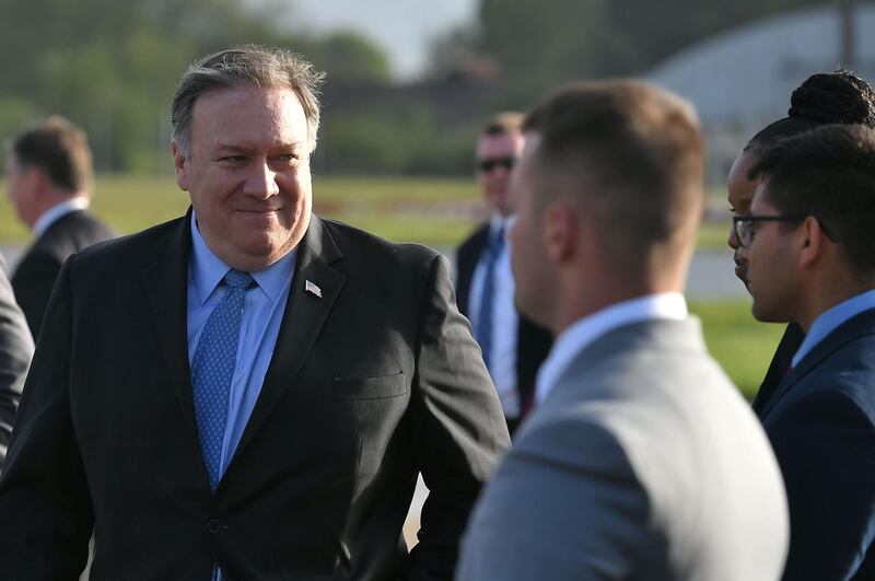 US Secretary of State Mike Pompeo walks to board a plane before departing from London Stansted Airport, north of London, on May 9, 2019.  US Secretary of State Mike Pompeo on May 9, 2019, put off a visit to Greenland, citing pressing business in Washington -- just two days after he also ditched a trip to Germany to fly to Iraq amid soaring tensions with Iran. / AFP / POOL / MANDEL NGAN
