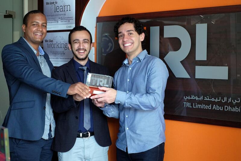 From left, Allan Pimenta, Asim Khanal and Jean Phelippe de Oliveira, master’s students at Masdar Institute of Science and Technology, after winning the TRL Student Award 2016 at Gulf Traffic. The three have designs on revolutionising Abu Dhabi’s bus system. Delores Johnson / The National