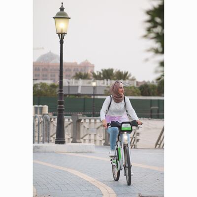 A Cyacle rider bikes along the Corniche in Abu Dhabi. Courtesy Cyacle