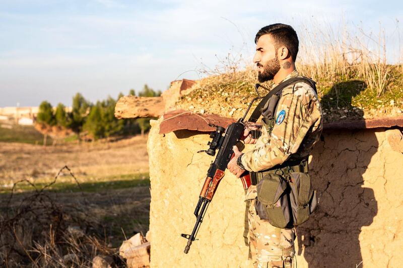 Fighters from a local Christian militia on the front line against Turkish affiliates, near the town of Tell Tamr. December 22, 2019. Thibault Lefébure for The National.  