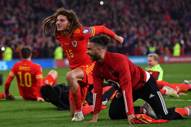 Wales' players celebrate victory and qualification for the Euro 2020 finals. AFP