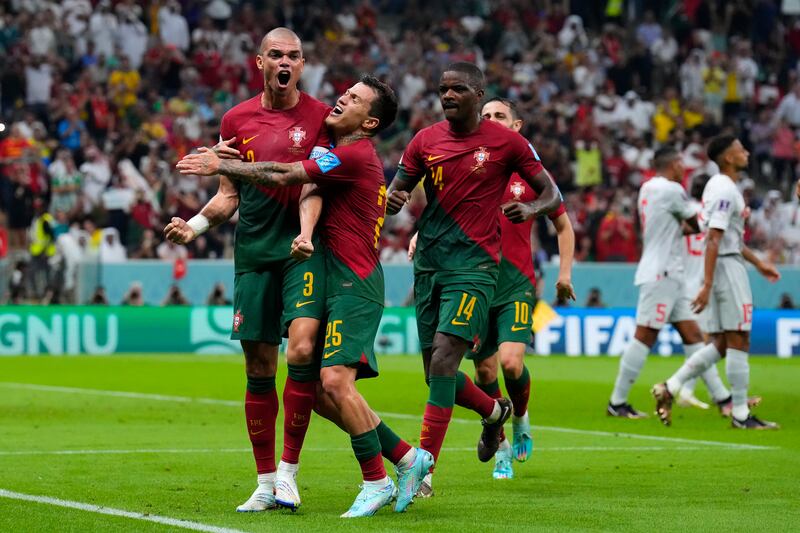 Portugal's Pepe, left, celebrates after scoring the second goal. AP