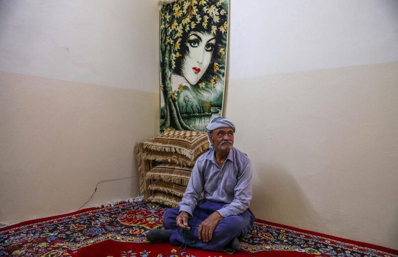 Moustafa Ibrahim, 67, an Iranian Kurd refugee sits for an interview at Bahrka refugee camp. Resident Behzad Mahmoudi set himself on fire last month in front of a UN office in Erbil, the draw attention to the refugees' plight. AFP