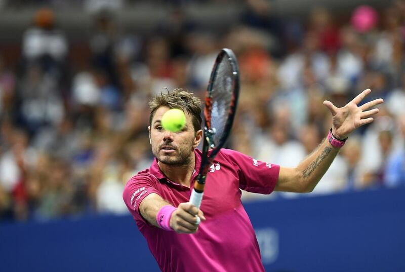 Stan Wawrinka of Switzerland hits a return against Novak Djokovic of Serbia. Jewel Samad / AFP