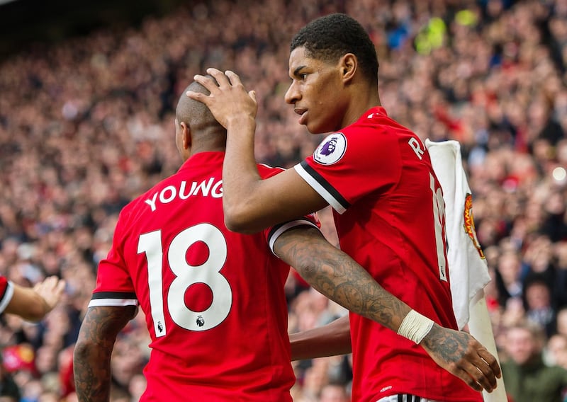 epa06593988 Manchester United's Marcus Rashford (R) celebrates with his teammate Ashley Young (L) after scoring the opening goal during the English Premier League soccer match between Manchester United and Liverpool FC at the Old Trafford in Manchester, Britain, 10 March 2018.  EPA/PETER POWELL EDITORIAL USE ONLY. No use with unauthorized audio, video, data, fixture lists, club/league logos or 'live' services. Online in-match use limited to 75 images, no video emulation. No use in betting, games or single club/league/player publications