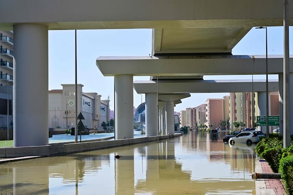 Cars are stranded on flooded streets in Dubai on April 19 following last week's heavy rains. AFP