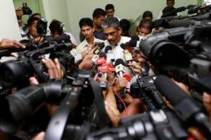 Sri Lanka's losing candidate, former army chief General Sarath Fonseka, speaks to the media after he met with elections commissioner Dayananda Disanayaka in Colombo January 3, 2010. Sri Lanka's elections commissioner on Wednesday rejected opposition allegations of counting fraud after last week's election, but said he would investigate complaints of vote-rigging brought to his office.      REUTERS/Dinuka Liyanawatte (SRI LANKA - Tags: POLITICS ELECTIONS) *** Local Caption ***  COL01_SRILANKA-POLI_0203_11.JPG