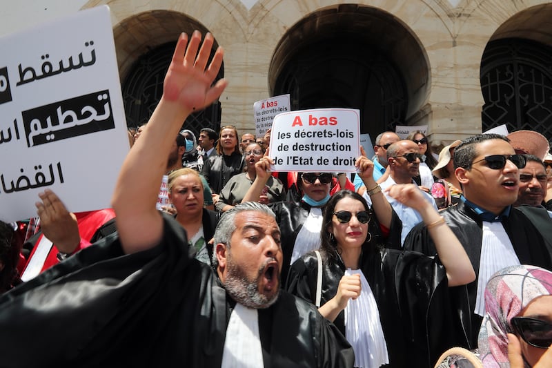 Tunisian judges outside the courthouse in Tunis protest against Kais Saied's June 1 decision to dismiss 57 magistrates. EPA