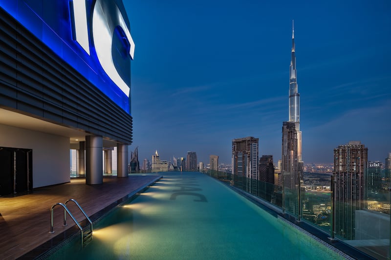 The property's infinity pool offers views of the city and Burj Khalifa.
