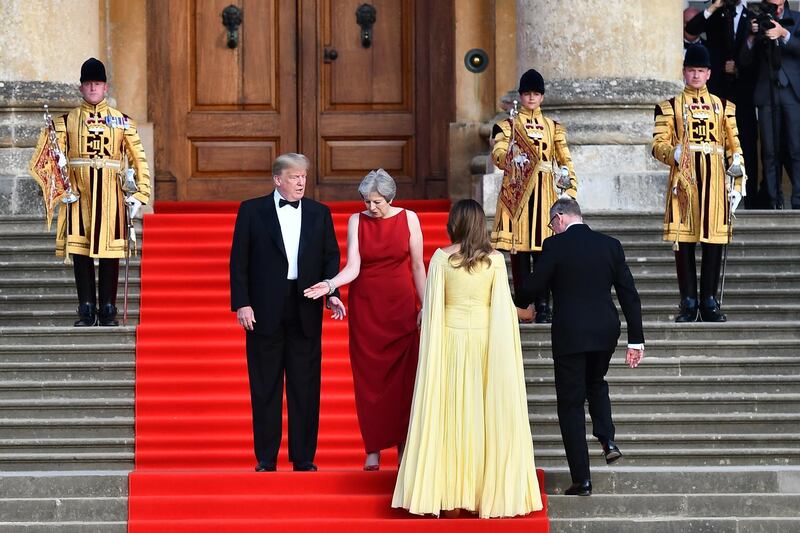 Theresa May and her husband Philip greet Donald Trump and his wife Melania at Blenheim Palace. Getty Images