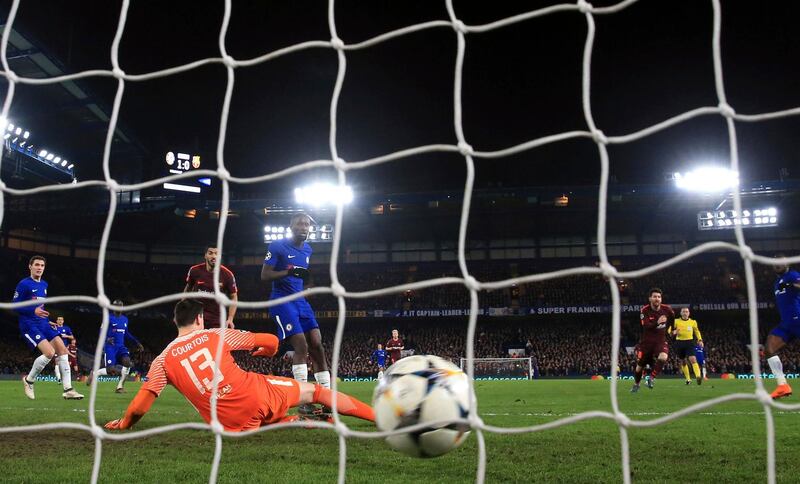 Barcelona's Lionel Messi, second right, celebrates scoring his side's first goal of the game during the Champions League round of sixteen first leg soccer match between FC Barcelona and Chelsea at Stamford Bridge stadium in London, Tuesday, Feb. 20, 2018. (Nick Potts/PA via AP)