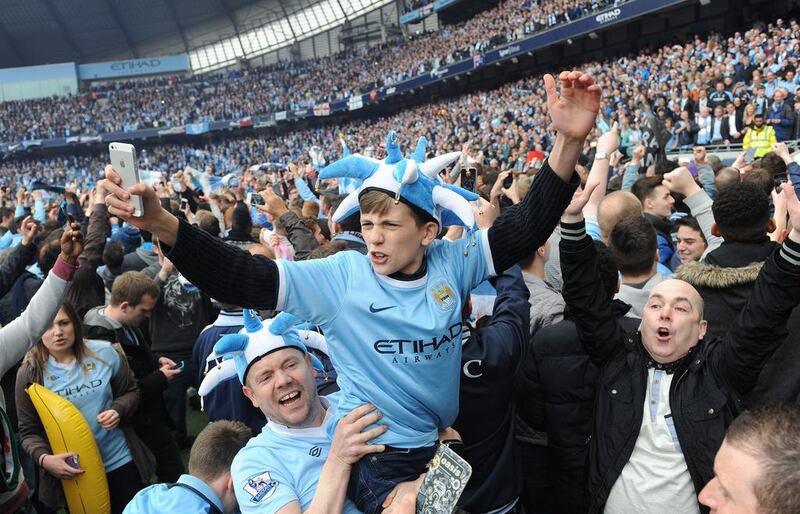 Raise your hands if you're double-jabbed! These Man City fans may need a vaccine passport this season. EPA