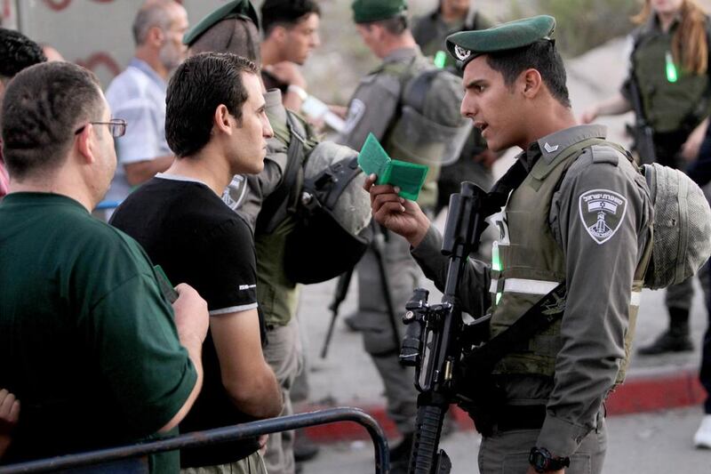 In the past Palestians have resisted Israel's occupation by refusing to carry their ID cards. Abbas Momani / AFP