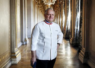 French chef Joel Robuchon poses in a corridor on January 14, 2016 in the Hotel de ville of Paris during the Grand Vermeil award ceremony, rewarding the best chefs of Paris. (Photo by FRANCOIS GUILLOT / AFP)