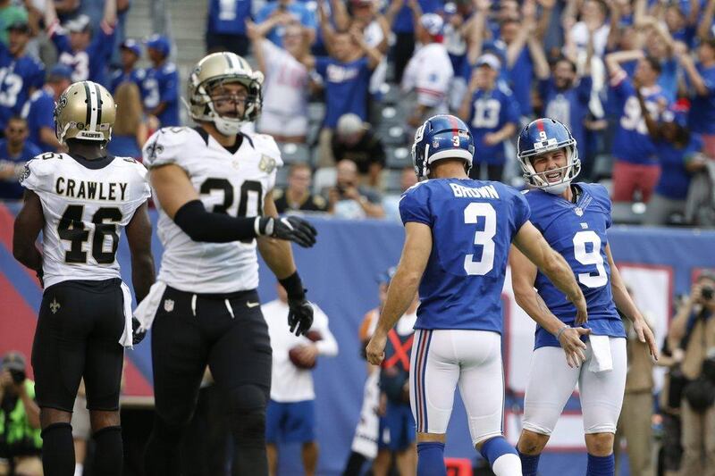 New York Giants 16 New Orleans Saints 13: Giants punter Brad Wing celebrates with kicker Josh Brown after the winning field goal. Kathy Willens / AP Photo