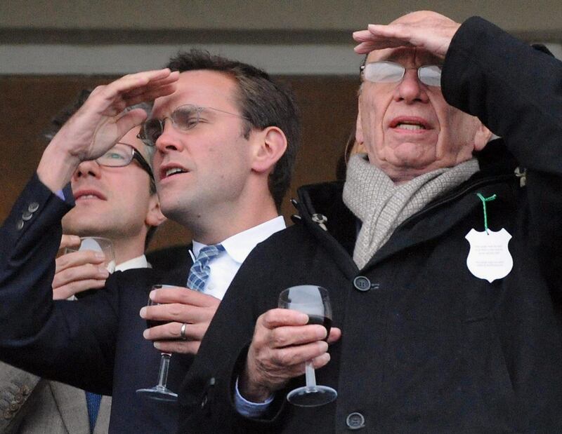 FILE-in this file photo dated March 18, 2010 showing James Murdoch, left, and Rupert Murdoch, right, during the Cheltenham Festival at Cheltenham, England. Rebekah Brooks has resigned Friday, July 15, 2011, as chief executive of Rupert Murdoch's embattled British newspapers.  Tom Mockridge, currently chief executive of News Corp.'s Sky Italia television unit, is appointed to succeed Brooks. (AP Photo/Barry Batchelor/PA, file) UNITED KINGDOM OUT - NO SALES - NO ARCHIVE *** Local Caption ***  Britain Phone Hacking.JPEG-03014.jpg