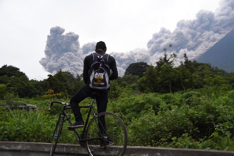 A man looks at the Fuego Volcano in eruption, from Alotenango municipality, Sacatepequez department, about 65 km southwest of Guatemala City, on June 3, 2015. Orlando Estrada / AFP