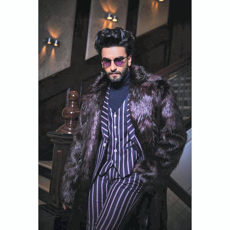 Singh added a fur coat to a striped suit for extra panache on in February 2019. Instagram / Ranveer Singh