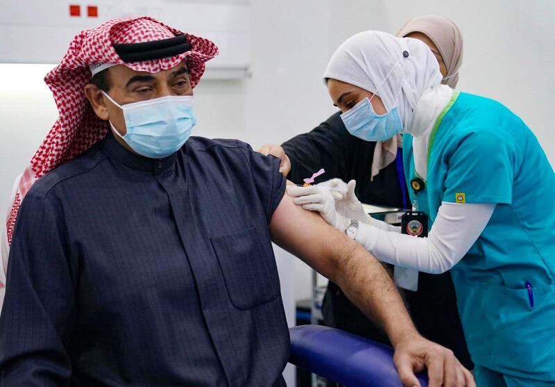 Kuwaiti Prime Minister Sheikh Sabah Al Khaled Al Sabah receives a Pfizer-BioTech Covid-19 vaccine injection at a vaccination centre in the capital Kuwait City. AFP