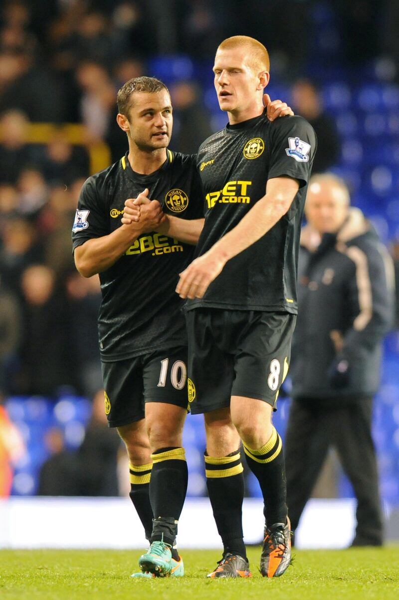 Wigan Athletic's English midfielder and goal-scorer Ben Watson (R) celebrates with Malaysian-born Scottish midfielder Shaun Maloney (L) after the English Premier League football match between Tottenham Hotspur and Wigan Athletic at White Hart Lane in north London, England on November 3, 2012. Wigan won the game 1-0. AFP PHOTO/OLLY GREENWOOD

RESTRICTED TO EDITORIAL USE. No use with unauthorized audio, video, data, fixture lists, club/league logos or “live” services. Online in-match use limited to 45 images, no video emulation. No use in betting, games or single club/league/player publications
 *** Local Caption ***  812681-01-08.jpg