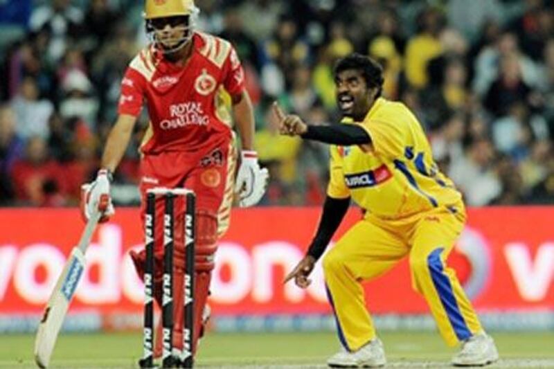 Muttiah Muralitharan, right, of Chennai Super Kings appeals unsuccessfully during the IPL semi-final match against Bangalore.