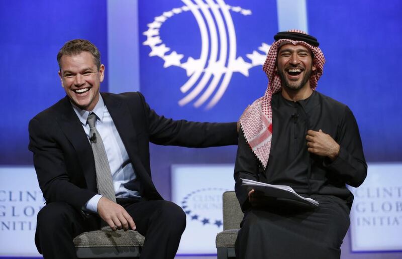 Actor Matt Damon laughs with Peyman Al Awadhi, the co-founder of Peeta Planet, while speaking at the Clinton Global Initiative in New YorkKevin Lamarque  / Reuters