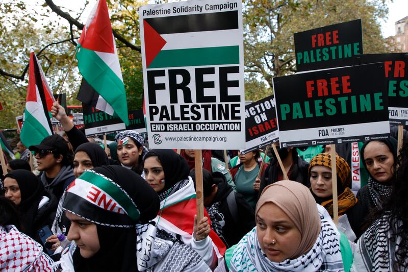 People take part in a 'March For Palestine' in London, to demand an end to the war on Gaza. AP