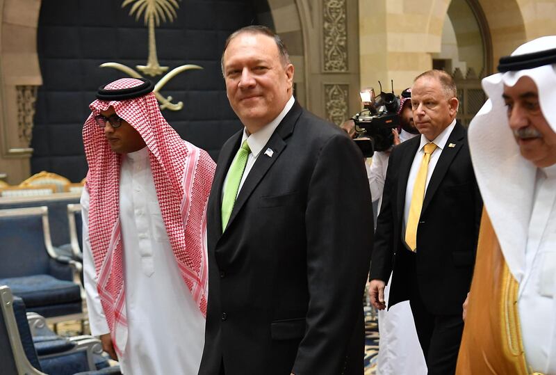 Mike Pompeo walks after stepping off his plane upon arrival at King Abdulaziz International Airport in Jeddah, Saudi Arabia.  AFP