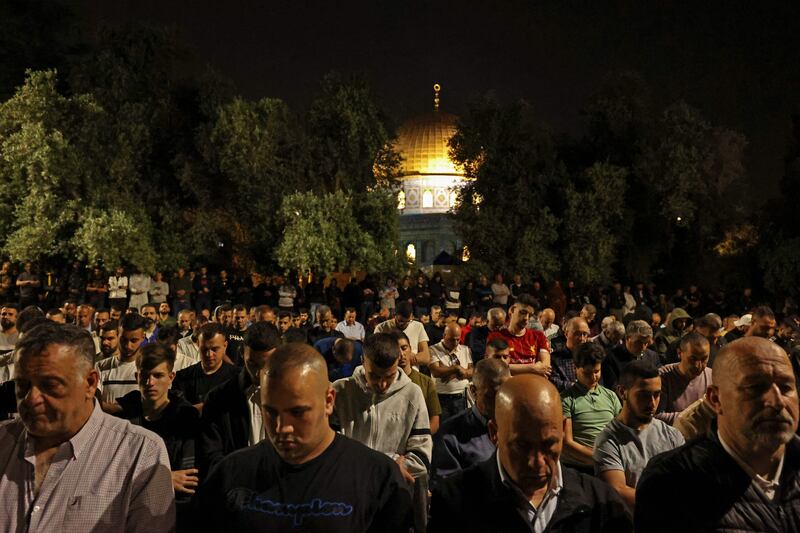 Palestinian devotees pray. AFP