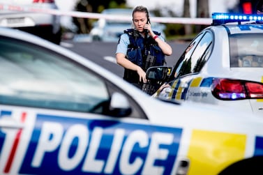 New Zealand police cordon off the area where an officer was fatally shot and another wounded during a traffic stop in a residential neighbourhood of Auckland on June 19, 2020. AFP